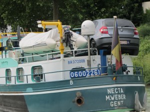 A car parked on this working boat